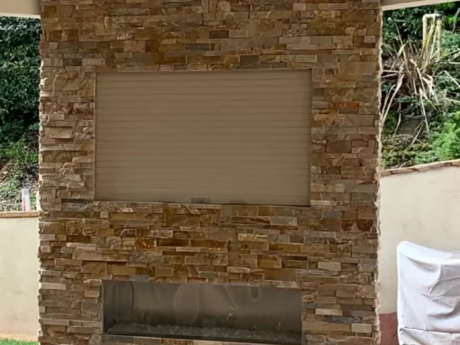A half-open rolling door for an outdoor patio.