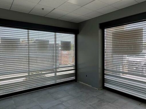 Perforated bronze shutters with consumer cellular branding detail